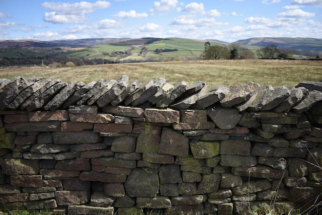 Dry stone wall to demonstrate computer patching is like maintaining a wall